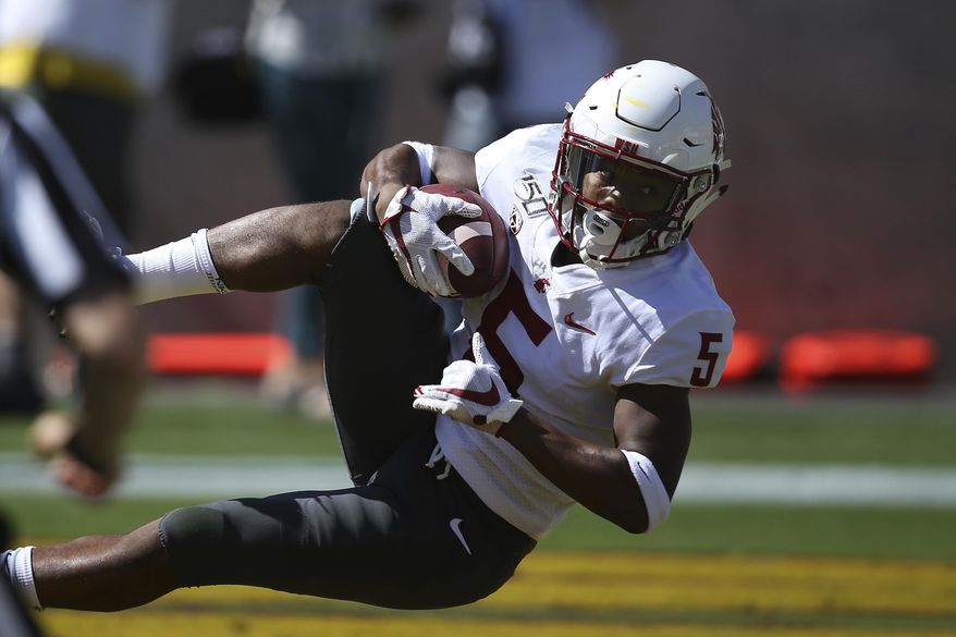 Washington State wide receiver Travell Harris makes a touchdown catch against Arizona State during the first half of an NCAA college football game Saturday, Oct. 12, 2019, in Tempe, Ariz. (AP Photo/Ross D. Franklin)