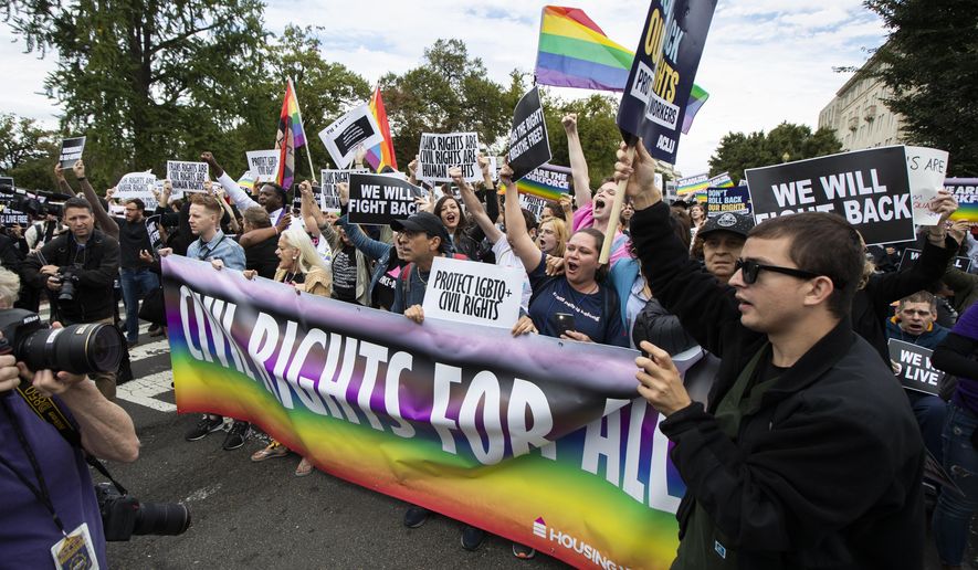 In this file photo, supporters of LGBT rights stage a protest on the street in front of the U.S. Supreme Court, Tuesday, Oct. 8, 2019, in Washington.  (AP Photo/Manuel Balce Ceneta) **FILE**