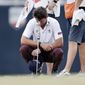 Lanto Griffin cries as he squats and rests his head on his putter after winning the Houston Open golf tournament Sunday, Oct, 13, 2019, in Houston. (AP Photo/Michael Wyke)