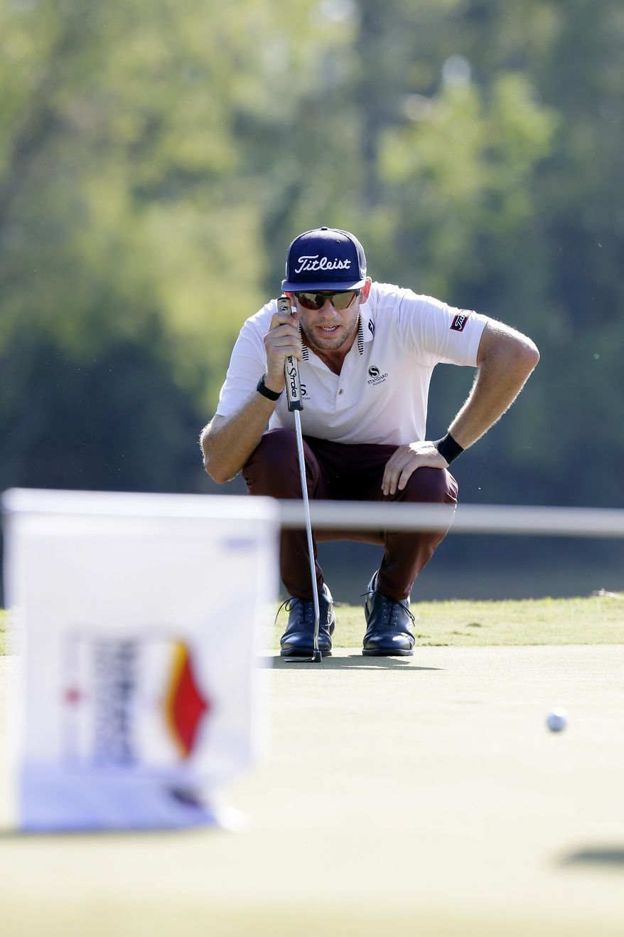 Lanto Griffin lines up his putt on the eighth green during the fourth round of the Houston Open golf tournament Sunday, Oct, 13, 2019, in Houston. (AP Photo/Michael Wyke)