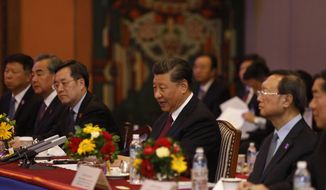 Chinese President Xi Jinping, center attends a bilateral meeting in Kathmandu, Nepal, Sunday, Oct. 13, 2019. Xi on Saturday became the first Chinese president in more than two decades to visit Nepal, where he&#39;s expected to sign agreements on some infrastructure projects. (Bikash Dware/The Rising Nepal via AP)