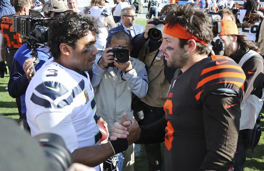 Seattle Seahawks quarterback Russell Wilson (3) and Cleveland Browns quarterback Baker Mayfield (6) talk after an NFL football game, Sunday, Oct. 13, 2019, in Cleveland. (AP Photo/Ron Schwane)