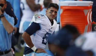 Tennessee Titans quarterback Marcus Mariota looks on from the sideline during the second half of an NFL football game against the Denver Broncos, Sunday, Oct. 13, 2019, in Denver. (AP Photo/David Zalubowski)
