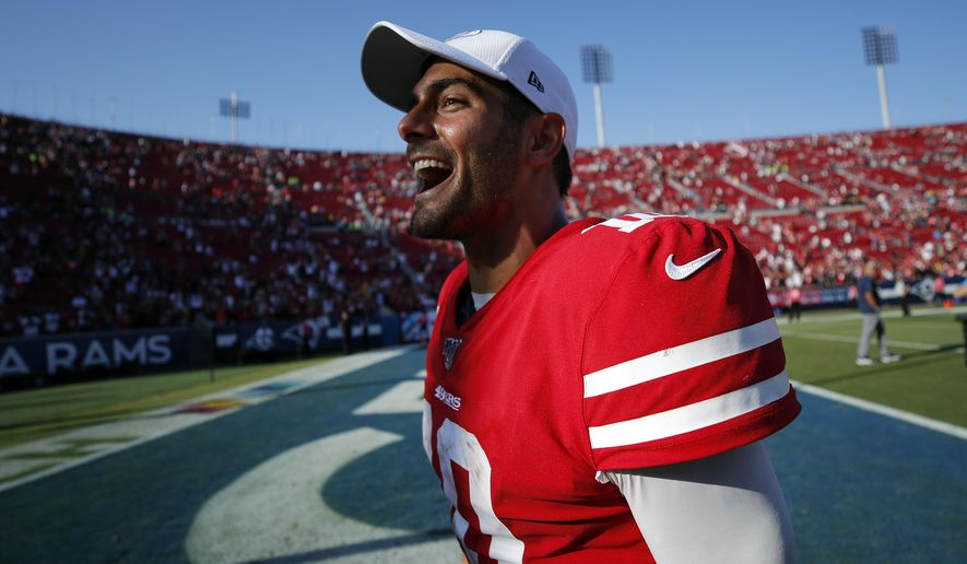 San Francisco 49ers quarterback Jimmy Garoppolo (10) celebrates after a 20-7 win over the Los Angeles Rams during an NFL football game Sunday, Oct. 13, 2019, in Los Angeles. (AP Photo/John Locher)