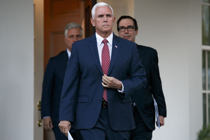 Vice President Mike Pence, center, with White House national security adviser Robert O'Brien, left, and Treasury Secretary Steven Mnuchin, left, adjusts his jacket as he approaches reporters outside the West Wing of the White House, Monday, Oct. 14, 2019, in Washington. (AP Photo/Jacquelyn Martin)