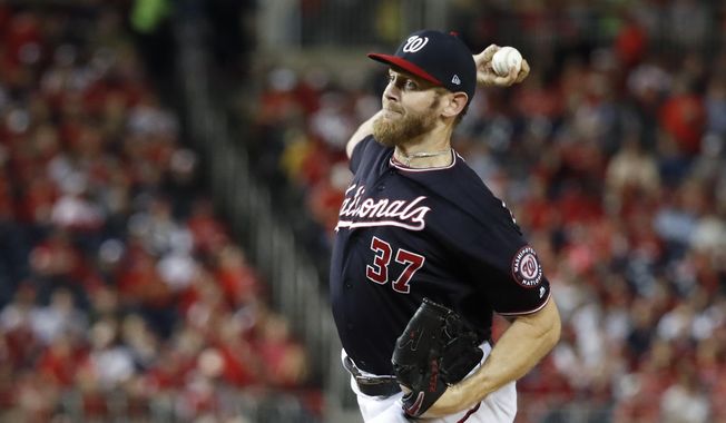 Washington Nationals starting pitcher Stephen Strasburg throws during the first inning of Game 3 of the baseball National League Championship Series against the St. Louis Cardinals Monday, Oct. 14, 2019, in Washington. (AP Photo/Jeff Roberson) ** FILE **