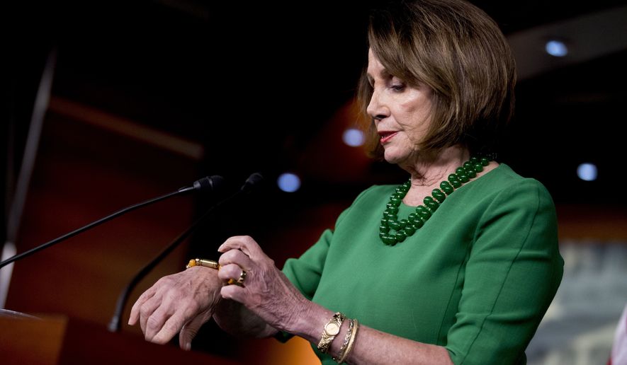 House Speaker Nancy Pelosi of Calif., talks about a bracelet made from a bullet for anti-gun legislation during a news conference on Capitol Hill in Washington, Tuesday, Oct. 15, 2019. (AP Photo/Andrew Harnik)