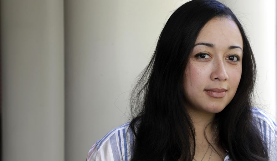 In this Sept. 20, 2019, photo, Cynthia Brown-Long poses in Nashville, Tenn. For nearly half of her life, Brown-Long was locked up. At 16, she was arrested for robbing and killing a man she says picked her up for sex and later sentenced to life in prison.  But two months ago, Brown-Long, 31, walked out of a Tennessee prison after successfully petitioning the Tennessee governor for her clemency. She’s now speaking for herself in her memoir, “Free Cyntoia: My Search for Redemption in the American Prison System,” released Tuesday, Oct. 15. (AP Photo/Mark Humphrey)