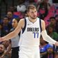 Dallas Mavericks forward Luka Doncic (77) gestures after a foul wasn&#39;t called during the team&#39;s NBA preseason basketball game against the Milwaukee Bucks on Friday, Oct. 11, 2019, in Dallas. (AP Photo/Richard W. Rodriguez)