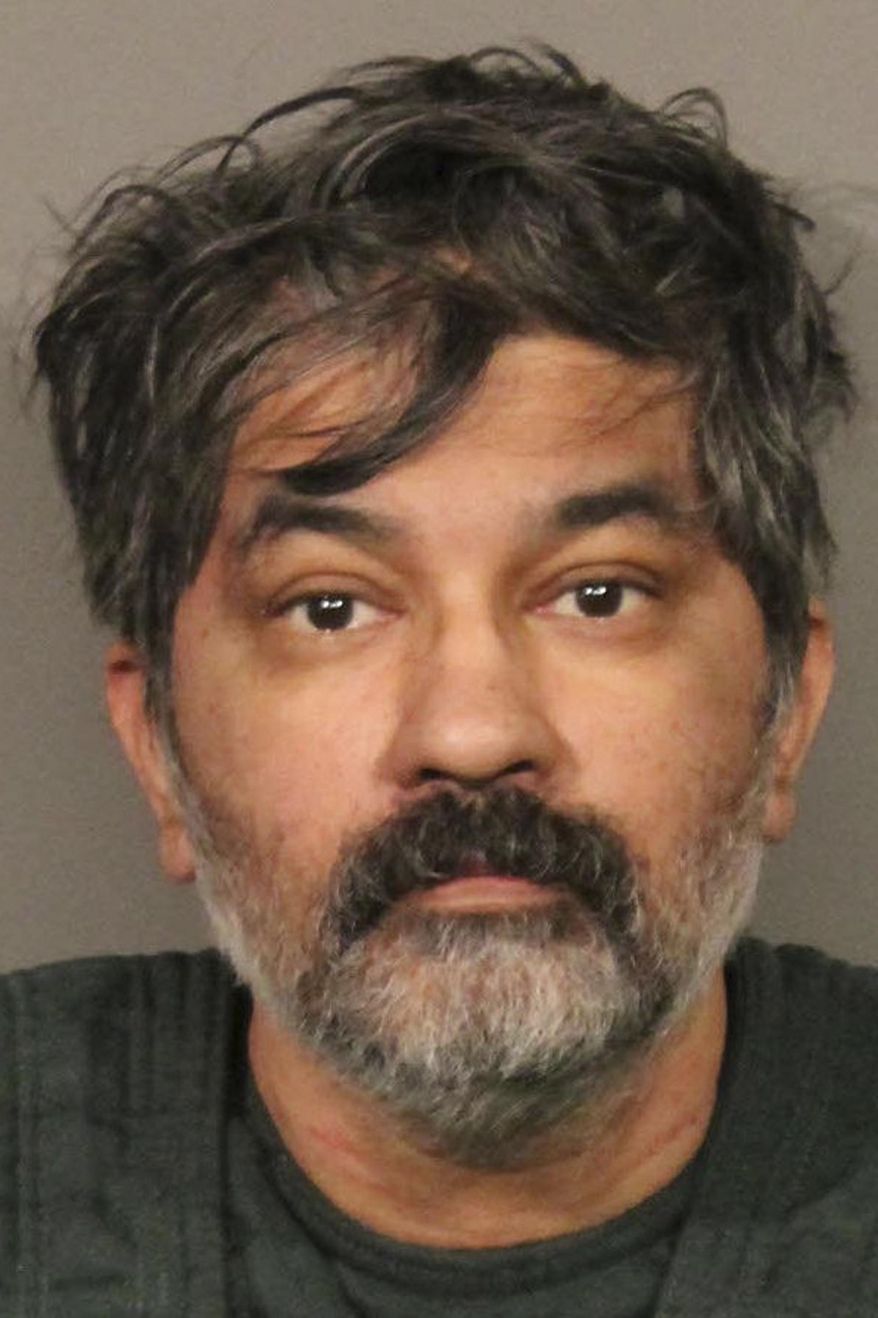 This photo released Tuesday, Oct. 15, 2019, by the Roseville, Calif., Police Department, shows Shankar Hangud, who police in Northern California have identified as the suspect who they say showed up at a police station with a dead body in his car and confessed to killing that person and another three members of a family. Roseville Police Capt. Josh Simon said Tuesday, Oct. 15, 2019, that the 53-year-old Hangud was arrested Monday after he turned himself in to Mount Shasta police and told investigators he had killed the man in his car. (Roseville Police Department via AP)