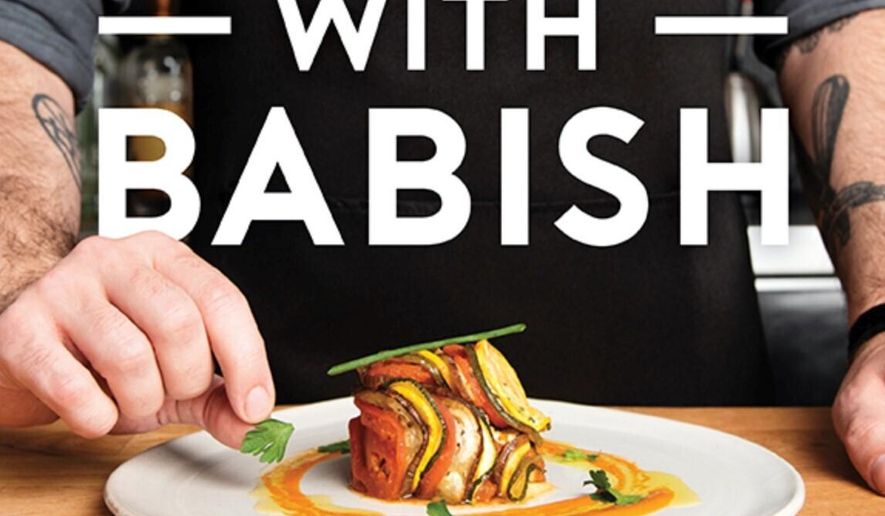 This cover image released by Houghton Mifflin Harcourt shows "Binging with Babish: 100 Recipes Recreated from Your Favorite Movies and TV Shows," by Andrew Rea. (Houghton Mifflin Harcourt via AP)