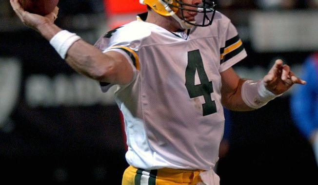 FILE In this Dec. 22, 2003, file photo, Green Bay Packers quarterback Brett Favre throws a pass against the Oakland Raiders in the second quarter of an NFL football game in Oakland, Calif. When it comes to emotional games, his four-touchdown against the Raiders the day after his father’s death in 2003 stands out above all the rest.  (AP Photo/Paul Sakuma, File)