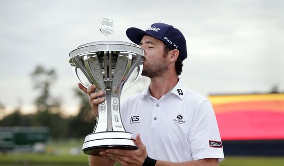 Lanto Griffin kisses the championship trophy during presentation ceremonies after winning the Houston Open golf tournament Sunday, Oct, 13, 2019, in Houston. (AP Photo/Michael Wyke) **FILE**