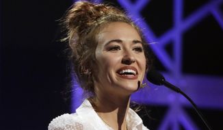 Lauren Daigle accepts the artist of the year award during the Dove Awards on Tuesday, Oct. 15, 2019, in Nashville, Tenn. (AP Photo/Mark Humphrey) **FILE**