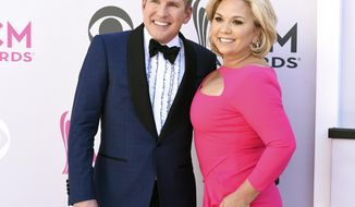 FILE - This April 2, 2017 file photo shows Todd Chrisley, left, and his wife Julie Chrisley at the 52nd annual Academy of Country Music Awards in Las Vegas. The couple are accusing a Georgia tax official of abusing his office to pursue &amp;quot;bogus tax evasion claims&amp;quot; against them. A spokesman for the Chrisleys said that the &amp;quot;Chrisley Knows Best&amp;quot; stars filed a federal lawsuit Tuesday against Joshua Waites, the director of the Georgia Department of Revenue&#39;s office of special investigations. The lawsuit says Waites targeted Todd Chrisley&#39;s estranged daughter and improperly shared confidential tax information to try to get compromising information.(Photo by Jordan Strauss/Invision/AP, File)