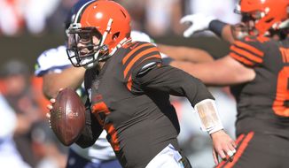 Cleveland Browns quarterback Baker Mayfield rushes for a 10-yard touchdown during the first half of an NFL football game against the Seattle Seahawks, Sunday, Oct. 13, 2019, in Cleveland. (AP Photo/David Richard)