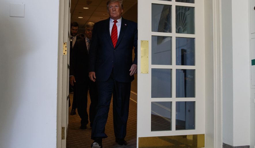 President Donald Trump arrives for an event to honor the 2019 Stanley Cup Champion St. Louis Blues, in the Rose Garden of the White House, Tuesday, Oct. 15, 2019, in Washington. (AP Photo/Evan Vucci)