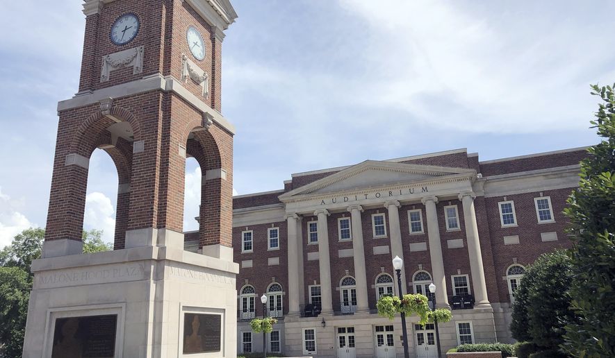 In this June 16, 2019 photo, the Autherine Lucy Clock Tower at the Malone Hood Plaza stands in front of Foster Auditorium on the University of Alabama campus in Tuscaloosa, Ala. The tower is named for Autherine Lucy, the first African-American student to attend the University of Alabama in 1956. Gov. George C. Wallace made a &quot;stand in the schoolhouse door&quot; at the auditorium&#39;s entrance on June 11, 1963, as he defied a federal order that the university admit African-American students Vivian Malone and James Hood, for whom the plaza is named. (AP Photo/Bill Sikes)