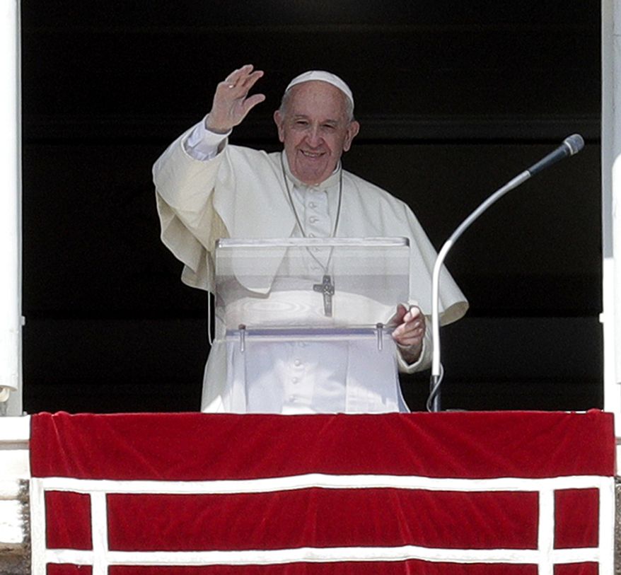 6. POPE FRANCIS Pope Francis delivers his blessing during the Angelus noon prayer he recited from the window of his studio overlooking St. Peter's Square, at the Vatican, Sunday, Oct. 6, 2019. The pontiff earlier in the morning celebrated in St. Peter's Basilica an opening Mass for the Amazon synod. (AP Photo/Andrew Medichini)