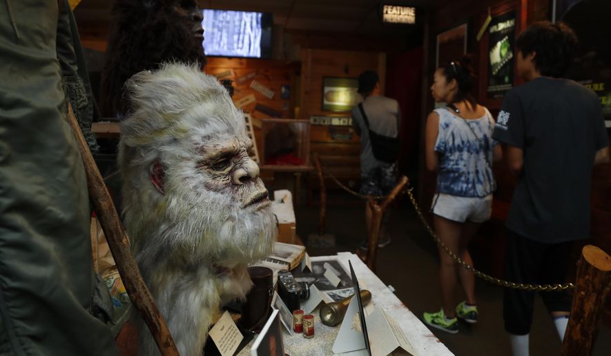 This Aug. 8, 2019, photo shows a Bigfoot mask and other items donated by the family of Yeti researcher Tom Slick on display at Expedition: Bigfoot! The Sasquatch Museum in Cherry Log, Ga. The owner of this intriguing piece of Americana at the southern edge of the Appalachians is David Bakara, a longtime member of the Bigfoot Field Researchers Organization who served in the Navy, drove long-haul trucks and tended bar before opening the museum in early 2016 with his wife, Malinda. (AP Photo/John Bazemore)