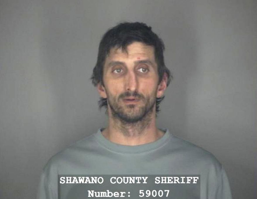 This Monday, Oct. 14, 2019 booking photo from the Shawano County Sheriff's Office shows Nathan Pogrant in Shawano, Wis. WLUK-TV reports that police arrested Pogrant Monday on charges including false imprisonment and child abuse after an 8-year-old boy told authorities that a man who lives with him and his mother strapped him to a chair in the basement of their northeastern Wisconsin home. The boy escaped and sought help from strangers. (Shawano County Sheriff's Office, WLUK-TV via AP)