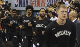 Brooklyn Nets&#39; players arrive for a match against Los Angeles Lakers at the NBA China Games 2019 in Shenzhen in south China&#39;s Guangdong province on Saturday, Oct. 12, 2019. (Color China Photo via AP)
