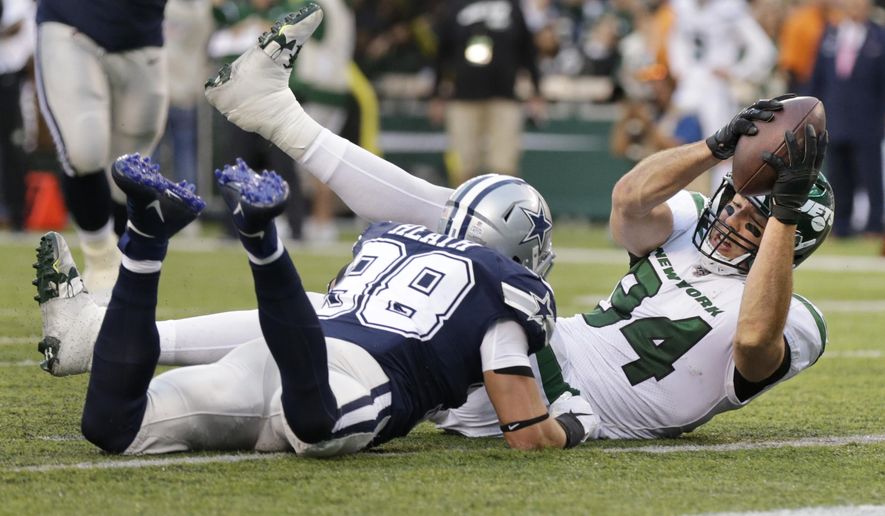 New York Jets&#39; Ryan Griffin, right, scores a touchdown during the first half of an NFL football game against the Dallas Cowboys, Sunday, Oct. 13, 2019, in East Rutherford, N.J. (AP Photo/Adam Hunger)