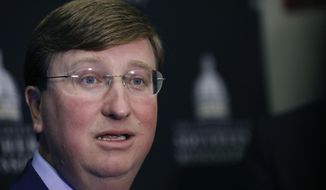 Republican Lt. Gov. Tate Reeves answers a reporter&#39;s question following the first televised gubernatorial debate with Democratic State Attorney General Jim Hood at the University of Southern Mississippi in Hattiesburg, Miss., Thursday, Oct. 10, 2019. (AP Photo/Rogelio V. Solis, Pool)