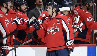 Washington Capitals defenseman John Carlson (74) celebrates his goal during the second period of the team&#39;s NHL hockey game against the Toronto Maple Leafs, Wednesday, Oct. 16, 2019, in Washington. (AP Photo/Nick Wass) ** FILE **