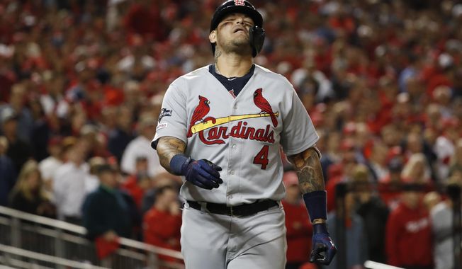 St. Louis Cardinals&#x27; Yadier Molina reacts after being hit by a pitch during the eighth inning of Game 4 of the baseball National League Championship Series against the Washington Nationals Tuesday, Oct. 15, 2019, in Washington. (AP Photo/Jeff Roberson)