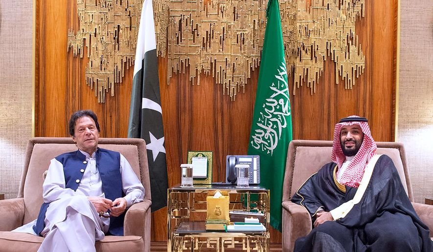 In this Tuesday, Oct, 15, 2019, photo released by Saudi Press Agency, SPA, Saudi Arabia's Crown Prince Mohammed bin Salman, right, meets with Pakistani Prime Minister Imran Khan, in Riyadh, Saudi Arabia. Khan's visit comes after traveling on Sunday to Iran, where he met President Hassan Rouhani and Supreme Leader Ayatollah Ali Khamenei. (Saudi Press Agency via AP)