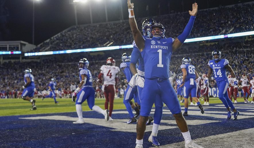 Kentucky quarterback Lynn Bowden Jr. (1) celebrates after scoring a touchdown during the first half of the team's NCAA college football game against Arkansas, Saturday, Oct. 12, 2019, in Lexington, Ky. (AP Photo/Bryan Woolston)