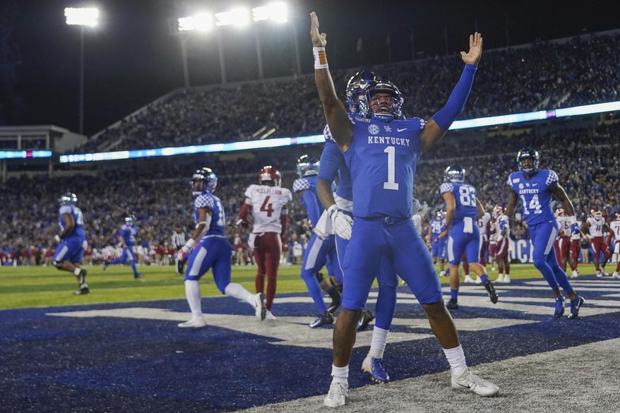 Kentucky quarterback Lynn Bowden Jr. (1) celebrates after scoring a touchdown during the first half of the team's NCAA college football game against Arkansas, Saturday, Oct. 12, 2019, in Lexington, Ky. (AP Photo/Bryan Woolston)