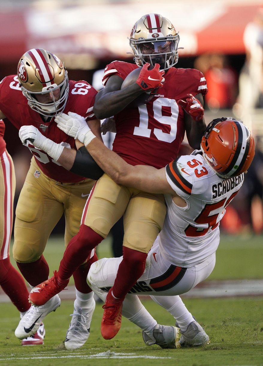 San Francisco 49ers wide receiver Deebo Samuel (19) is tackled by Cleveland Browns middle linebacker Joe Schobert (53) during the first half of an NFL football game in Santa Clara, Calif., Monday, Oct. 7, 2019. At left is 49ers offensive tackle Mike McGlinchey. (AP Photo/Tony Avelar)