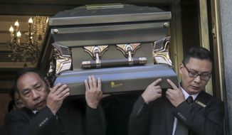 Pallbearers carry the casket of Chuen Kok from the Ng Fook Funeral Home, Friday Oct. 18, 2019, in New York. Kok, an 83-year-old homeless man whom Chinatown residents warmly greeted as &amp;quot;uncle,&amp;quot; was one of four homeless men bludgeoned to death in the community last week. (AP Photo/Bebeto Matthews)