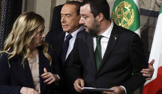 FILE - In this Thursday, April 12, 2018 file photo, Forza Italia Leader Silvio Berlusconi, center, Brothers of Italy party Leader Giorgia Meloni, left, and Northern League Leader Matteo Salvini meet journalists at the Quirinale presidential palace after talks with Italian President Sergio Mattarella, in Rome. Italy’s politically battered Matteo Salvini and ally Giorgia Meloni are preparing for a weekend march on Rome to rally the right-wing after Salvini’s political miscalculation got him ousted from his powerful post as interior minister. Meloni’s post-fascist Brothers Of Italy party is growing in popularity as Italy’s political landscape shifts even more toward the right. Salvini calls the rally “a peaceful day of Italian pride” but many believe it will attract far-right extremists. (AP Photo/Gregorio Borgia, File)