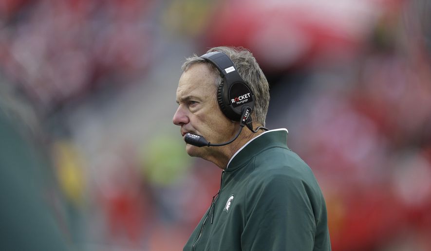 Michigan State head coach Mark Dantonio looks on during the second half of an NCAA college football game against Wisconsin Saturday, Oct. 12, 2019, in Madison, Wis. Wisconsin won 38-0. (AP Photo/Andy Manis)