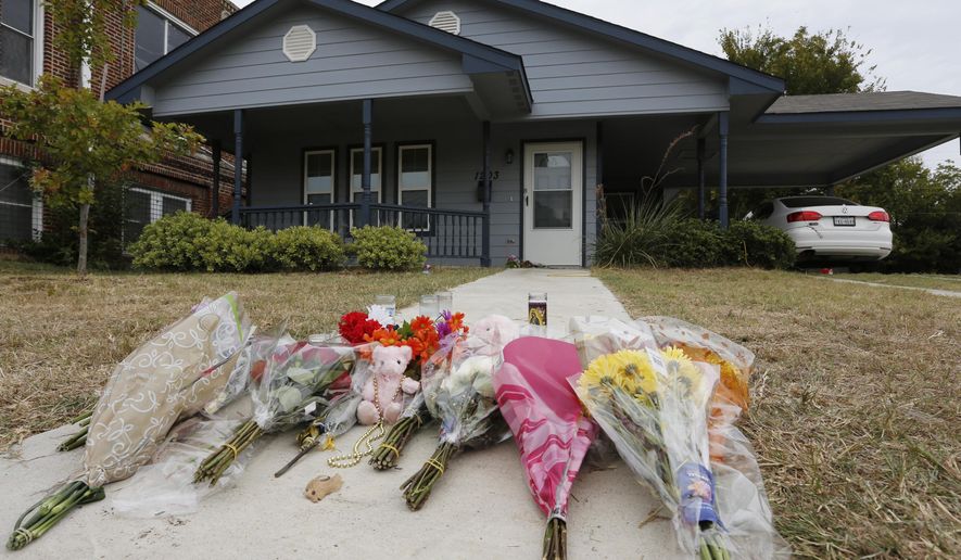 FILE - In this Monday, Oct. 14, 2019 photo, flowers lie on the sidewalk in front of the house in Fort Worth, Texas, where a white Fort Worth police officer Aaron Dean shot and killed Atatiana Jefferson, a black woman, through a back window of her home. Dean resigned before he could be compelled to undergo questioning. After a police officer fatally shoots someone, it can take days or even weeks before the public or his supervisors hear the officer’s version of what happened. (AP Photo/David Kent, File)