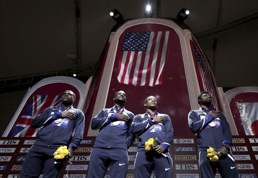 Gold medalists from left, Christian Coleman, Justin Gatlin, Michael Rodgers and Noah Lyles of the United States take part in the medal ceremony for the men's 4x100 meter relay at the World Athletics Championships in Doha, Qatar, Sunday, Oct. 6, 2019. (AP Photo/Nariman El-Mofty)