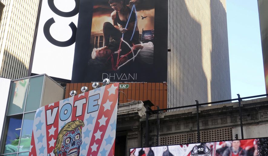 A billboard in New York City's Time Square depicts President Donald Trump being hogtied by a woman clad in athletic wear on Friday, Oct. 18, 2019. The The 30-foot-high billboard is part of an advertising campaign by Dhvani, a Portland-based clothing company. CEO of Dhvani Avi Brown told The Associated Press the billboard was intended to be a comment on the Trump administration's changes to the Title X family planning program blocking federal funding for health providers who refer patients for abortions. (AP Photo/Ted Shaffrey)