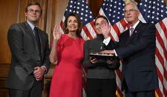 FILE - In this Jan. 3, 2019, file photo, House Speaker Nancy Pelosi of Calif., second from left, poses during a ceremonial swearing-in with Rep. Francis Rooney, R-Fla., right, on Capitol Hill in Washington. said out loud Friday, Oct. 19, what others in his party are not, namely that White House Chief of Staff Mick Mulvaney acknowledged a “quid pro quo” was at work when Trump held up U.S. aid to Ukraine in exchange for Kyiv’s investigation of Democrats and the 2016 elections. Mulvaney later claimed his comments had been misconstrued, but Rooney says he and other Republicans heard them clearly. (AP Photo/Susan Walsh, File)