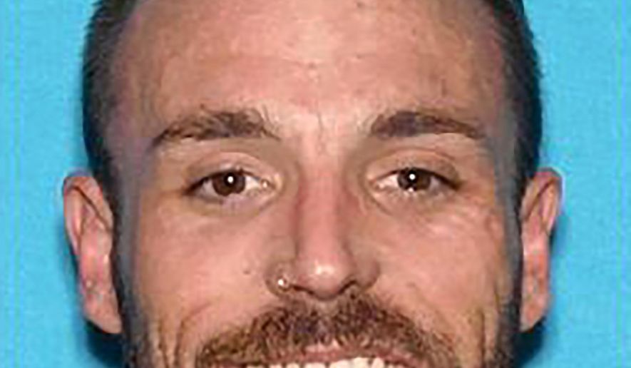 In this undated photo released by the Anaheim Police Department is Adrian Darren Bonar. Authorities say a man's body was found in the trunk of an abandoned car near an Orange County freeway. The Anaheim Police Department said Saturday, Oct. 19, 2019, that the man has been identified as 34-year-old Bonar of Escondido, Calif. Anaheim police say California Highway Patrol was preparing to tow the vehicle Thursday when officials discovered the body wrapped in a tarp in the trunk. (Anaheim Police Department via AP)