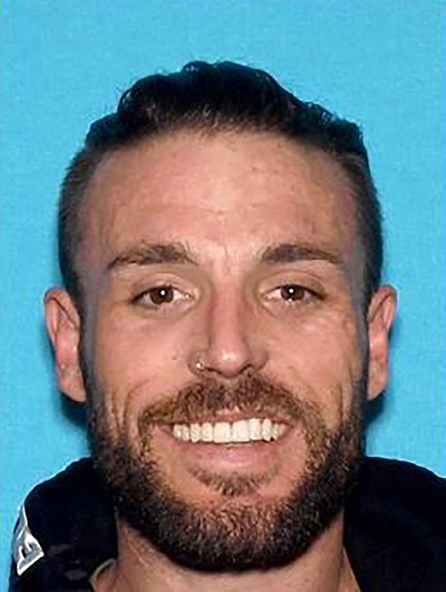 In this undated photo released by the Anaheim Police Department is Adrian Darren Bonar. Authorities say a man's body was found in the trunk of an abandoned car near an Orange County freeway. The Anaheim Police Department said Saturday, Oct. 19, 2019, that the man has been identified as 34-year-old Bonar of Escondido, Calif. Anaheim police say California Highway Patrol was preparing to tow the vehicle Thursday when officials discovered the body wrapped in a tarp in the trunk. (Anaheim Police Department via AP)