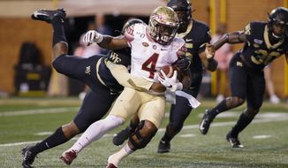 Florida State running back Khalan Laborn (4) fights for yards against Wake Forest in the first half of an NCAA college football game in Winston-Salem, N.C., Saturday, Oct. 19, 2019. (AP Photo/Nell Redmond)