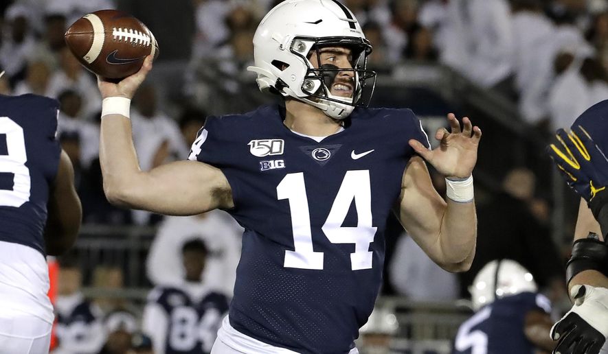 Penn State quarterback Sean Clifford throws a pass during the first half of the team's NCAA college football game against Michigan in State College, Pa., Saturday, Oct. 19, 2019. (AP Photo/Gene J. Puskar)