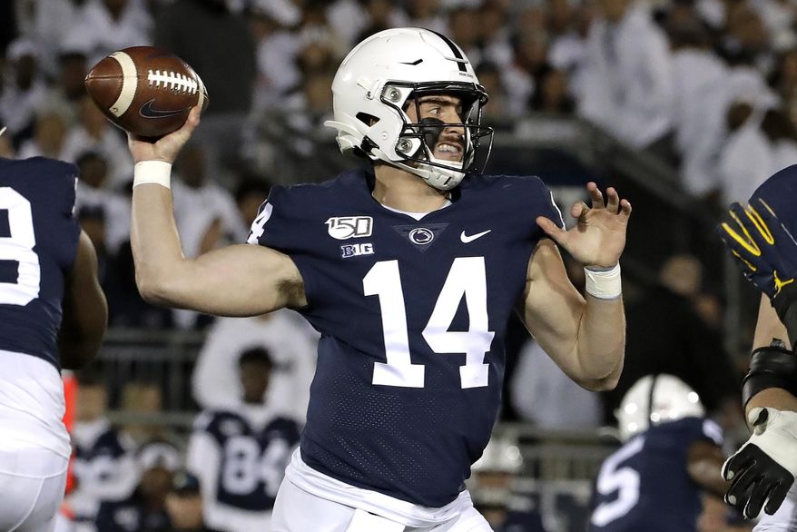 Penn State quarterback Sean Clifford throws a pass during the first half of the team's NCAA college football game against Michigan in State College, Pa., Saturday, Oct. 19, 2019. (AP Photo/Gene J. Puskar)