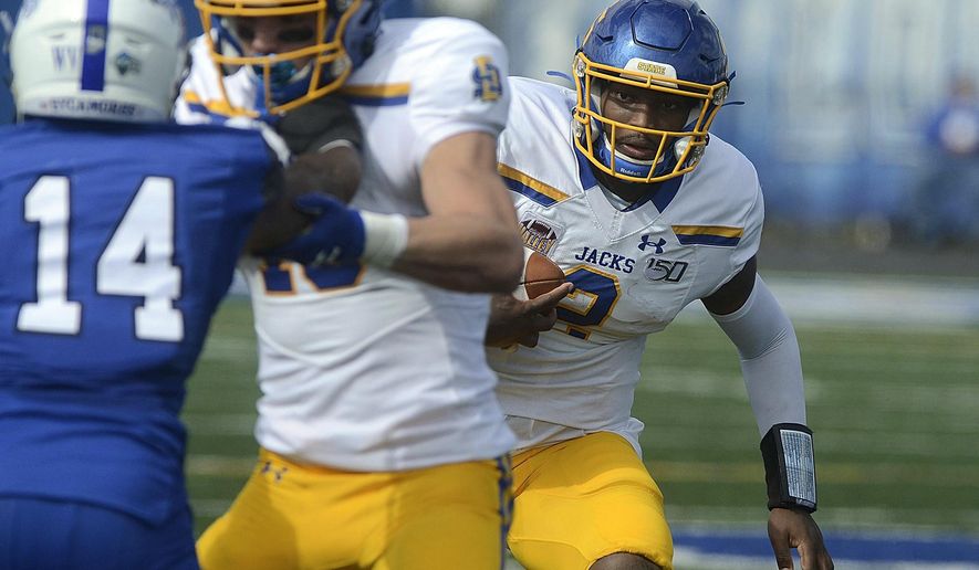South Dakota State quarterback J'Bore Gibbs, right, runs the ball against Indiana State during an NCAA college football game, Saturday, Oct. 19, 2019, in Terre Haute, Ind. (Joseph C. Garza/The Tribune-Star via AP)