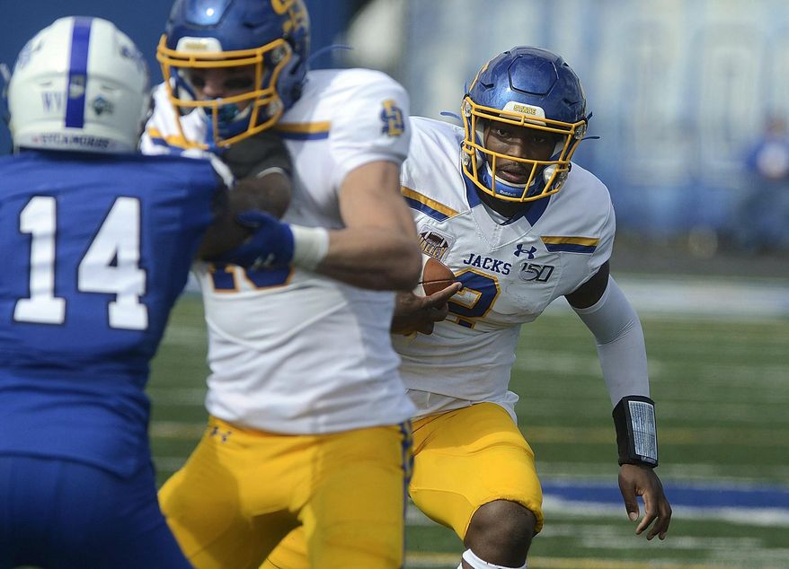 South Dakota State quarterback J'Bore Gibbs, right, runs the ball against Indiana State during an NCAA college football game, Saturday, Oct. 19, 2019, in Terre Haute, Ind. (Joseph C. Garza/The Tribune-Star via AP)