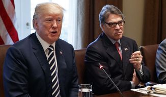 In this March 20, 2018, file photo, President Donald Trump speaks during a working lunch with Saudi Crown Prince Mohammed bin Salman (not shown) in the Cabinet Room of the White House with Energy Secretary Rick Perry. (AP Photo/Evan Vucci, File)