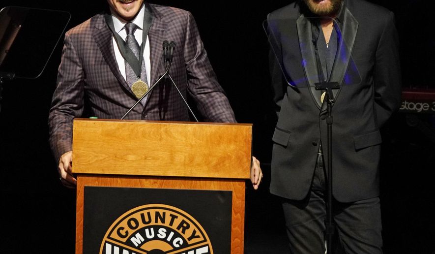 Kix Brooks, left, and Ronnie Dunn, right, speak after being inducted into the Country Music Hall of Fame at 2019 Medallion Ceremony at the Country Music Hall of Fame and Museum on Sunday, Oct. 20, 2019 in Nashville, Tenn. (Photo by Sanford Myers/Invision/AP)